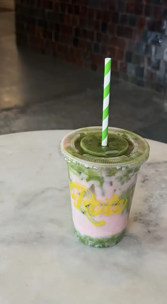 Iced matcha in a Roto cup on a marble table